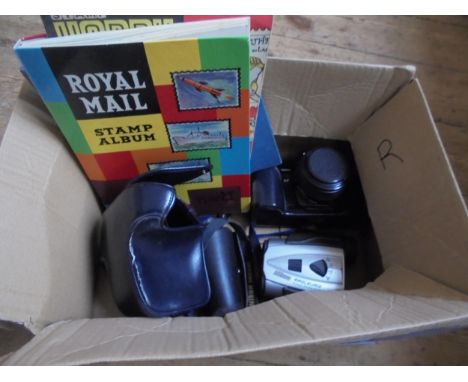 A Minolta SLR camera, pair of eagle view binoculars by Nikon, a pack of strirrup cups and two stamp albums with various world