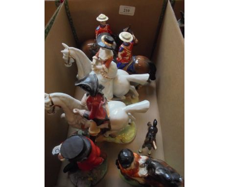 Collection of 5 ceramic horse ornaments, two with mounted police, one with gentlemen and lady riding side saddle, Victorian h