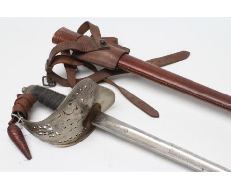 AN 1897 PATTERN OFFICER'S SWORD, by Joseph H. Barker of Sheffield, the 32 1/4" fullered blade bearing maker's name and etched