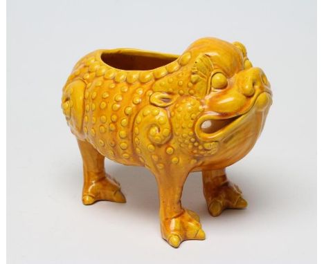 A LARGE BURMANTOFTS POTTERY TOAD SPOON WARMER, standing on three legs in an ochre glaze, impressed and incised AF(?), 6 1/2" 