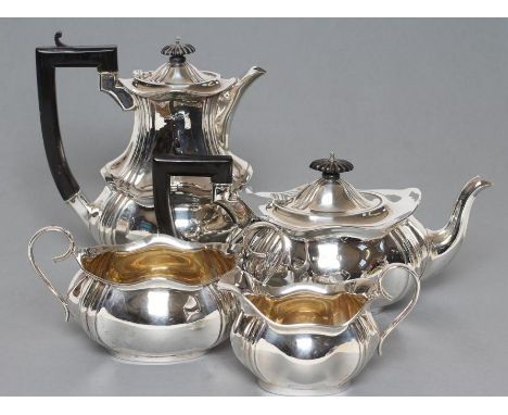 A FOUR PIECE TEA AND COFFEE SERVICE, maker T. Bishton, Birmingham 1918, of lobed oblong baluster form comprising tea and coff