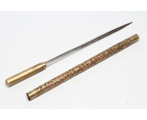 A SWAGGER SWORD STICK, with 12 1/4" flat section blade, plain brass grip and brass body with foliate pierced design revealing