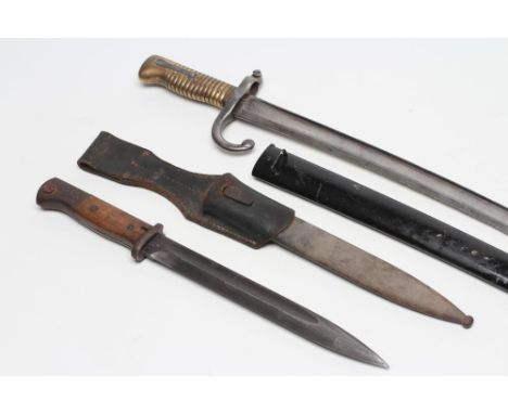 A K98 BAYONET, with 10" blade, two piece wood grip, metal scabbard and leather frog, blade and scabbard both stamped 43ASW an