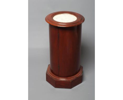 A VICTORIAN MAHOGANY CYLINDRICAL BEDSIDE CUPBOARD,  the moulded edged top inset with white marble, door below enclosing shape