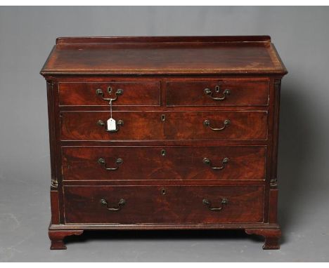 A GEORGIAN MAHOGANY CHEST, late 18th century and later, the moulded edged ledge back with oak banding, two short over three l