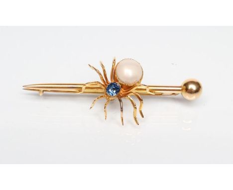 AN EDWARDIAN SPIDER BROOCH with oval facet cut sapphire head and blister pearl body on arrow head bar, stamped S.S.&amp; Co.,