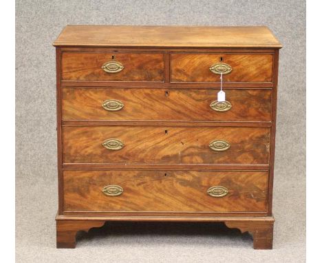 A GEORGIAN MAHOGANY CHEST, last quarter 18th century, the moulded edged top over two short and three long drawers with later 