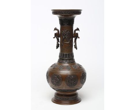 A JAPANESE BRONZE VASE of baluster form with cast and applied dragon handles and panels of mythical beasts, cast seal to base
