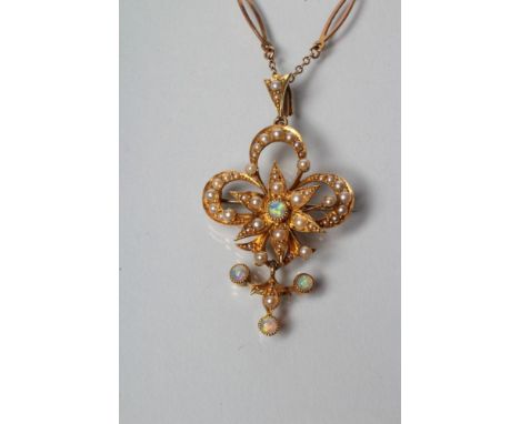 AN EDWARDIAN PENDANT/BROOCH, the open trefoil centred by a star all set with seed pearls and opal centre point, hung with a s