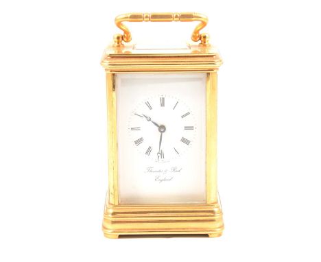Brass cased carriage clock by Thwaites &amp; Reed, enamelled rectangular dial, timepiece movement, 13cm, with key.