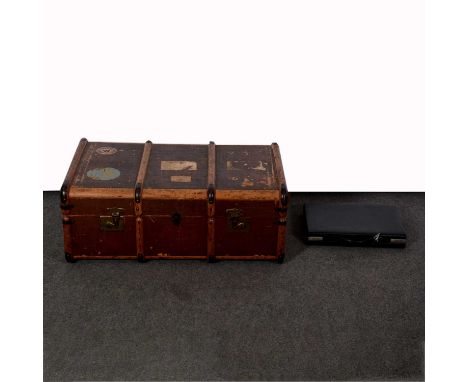 A vintage travelling trunk, canvas lined with tray, width 84cm, depth 53cm; and a black leather small briefcase or attache ca