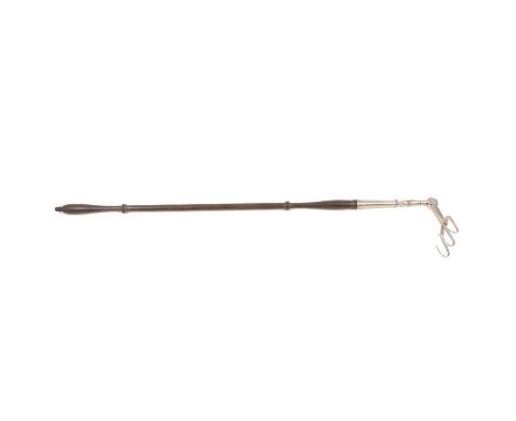 An antique three pronged hinged steel toasting fork with turned wooden handle, 62cm.