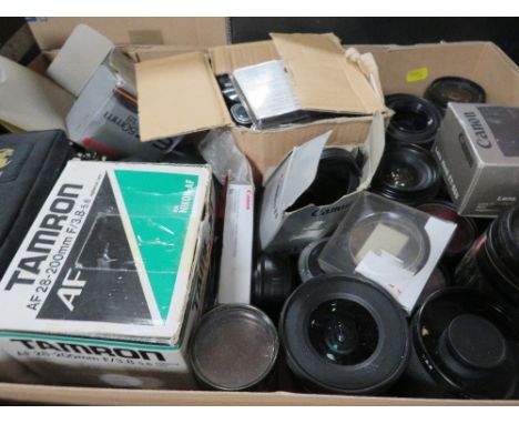 A tray of camera lens and assorted equipment
