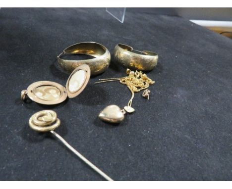 A quantity of yellow metal jewellery, including a coiled snake top, stick pin