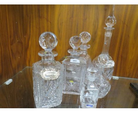 A collection of assorted decanters and decanter labels