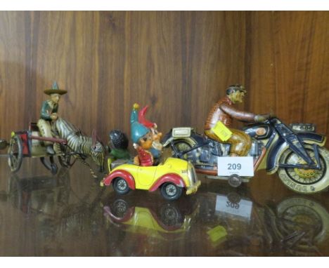 Two tin plate toy figures together with a Corgi Noddy car