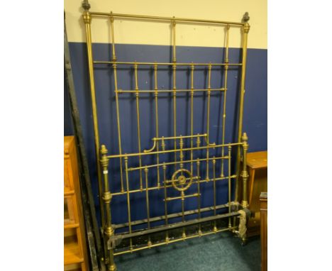 An antique brass bed frame with side irons H 224 cm W 138 cm