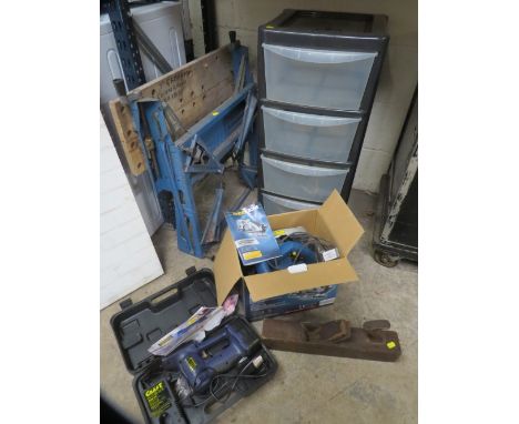 A selection of tools to include a boxed circular saw, cordless garden combination trimmer, a wooden block plane, a set of pla