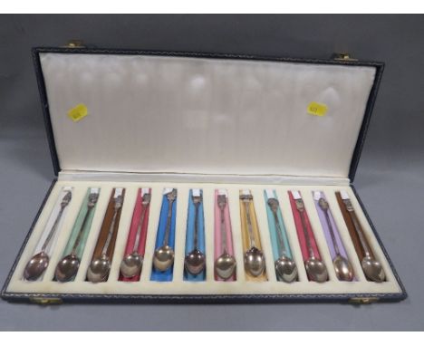 A cased set of 12 hallmarked silver Zodiac finial spoons approx weight 111g