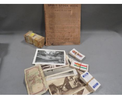 A small collection of ephemera to include Dinky car, 1880's Spirit stock book, postcards, tea cards etc