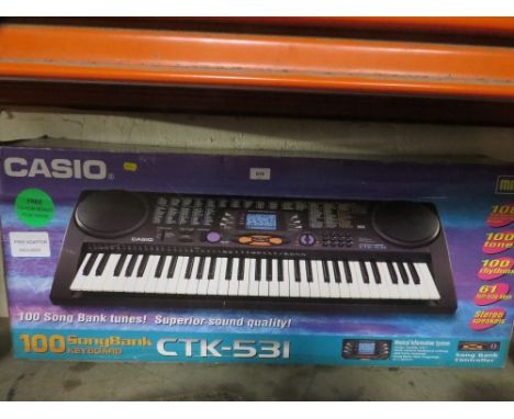 A boxed Casio keyboard - unchecked