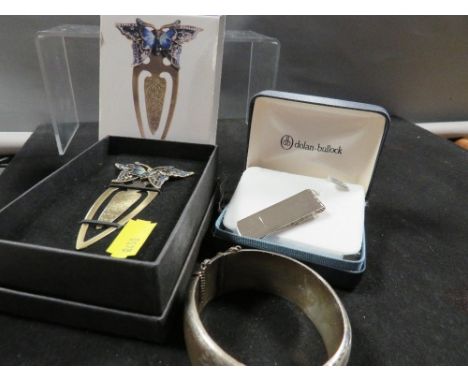 A hallmarked silver clasp bangle together with a 925 silver money clip etc
