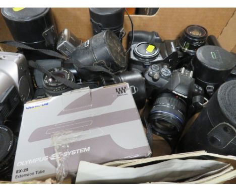 A tray of Olympus camera equipment, to include an E-410 camera and a selection of lens etc