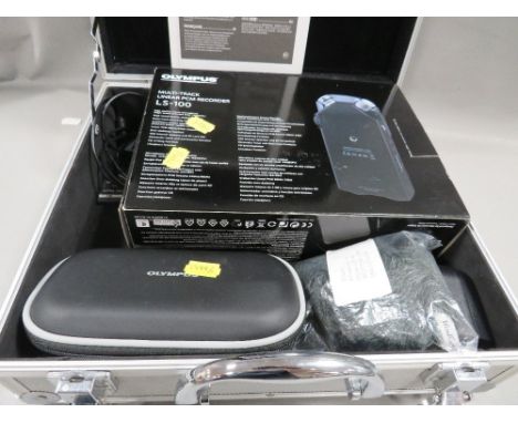 An Olympus multi track linear PCM recorder in metal carry case, with instruction book