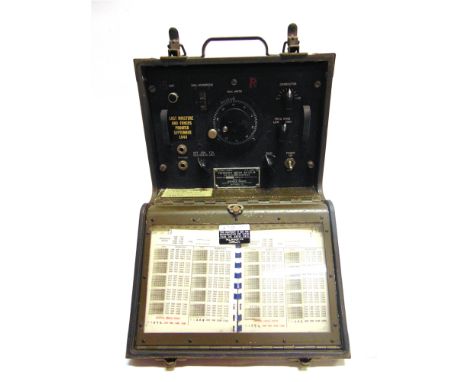 A SECOND WORLD WAR U.S. ARMY SIGNAL CORPS FREQUENCY METER BC-221-M  by Bendix Radio, serial number 9130, in a khaki-painted c