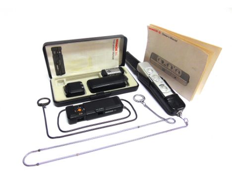 TWO MINOX SUB-MINIATURE CAMERAS  comprising a Minox C, with owner's manual; and a Minox EC, with instruction manual, in a fit
