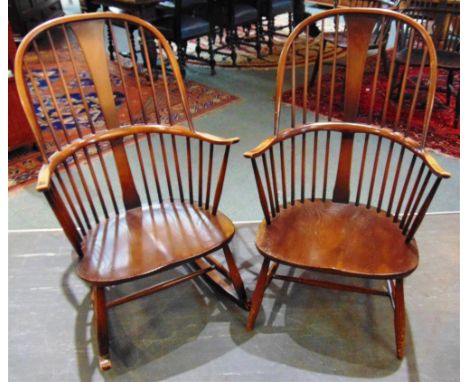 A LARGE ERCOL WINDSOR ROCKING CHAIR  and matching armchair, each with vase shaped central splat on H-shaped stretcher bases