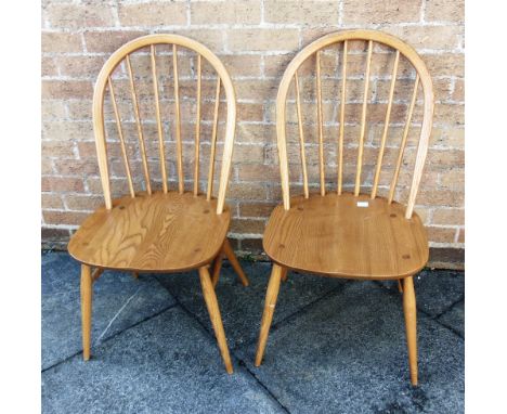 A PAIR OF LIGHT ERCOL STICKBACK WINDSOR CHAIRS