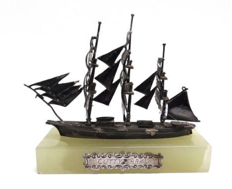 A CONTINENTAL MODEL OF THE 'CUTTY SARK'  stamped '800' and 'BRO', approximately 12.5cm long, on a green 'Mexican Onyx' base w