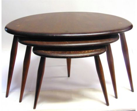 A NEST OF THREE ERCOL 'PEBBLE' OCCASIONAL TABLES  the largest 65cm wide