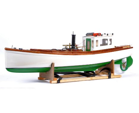 A beautifully made large scale radio controlled live steam model of a boat. Fitted with a believed Cheddar twin-piston engine