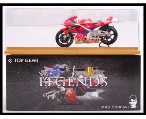 A superbly detailed 1:43 scale precision diecast model by Top Gear. From the ' Legends ' series. TGL02 - Mick Doohan, Honda N