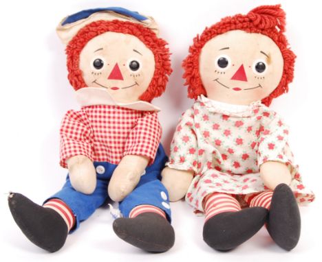 A pair or rare vintage Raggedy Ann&nbsp;Johnny Gruelle dolls. Both with printed faces and typical ' triangle ' noses to face.