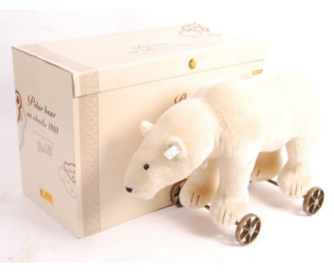 A rare large 20th century Steiff made ' Polarbar Auf Radern - 1910 ' - replica of a 1910 Polar Bear. Appears as new, with ear