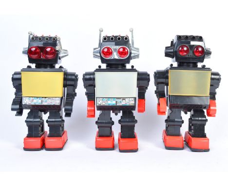 A collection of 3x vintage 1980's Kamco Hong Kong made Saturn 13" Giant Walking Robot. The robots each having large TV to the