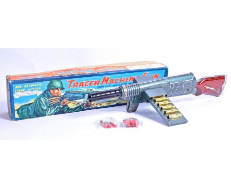 A rare vintage Japanese K Toys made tinplate ' Tracer Machine Gun ' ' Shootin' Bullets - Real Sound '. Litho-printed tin plat