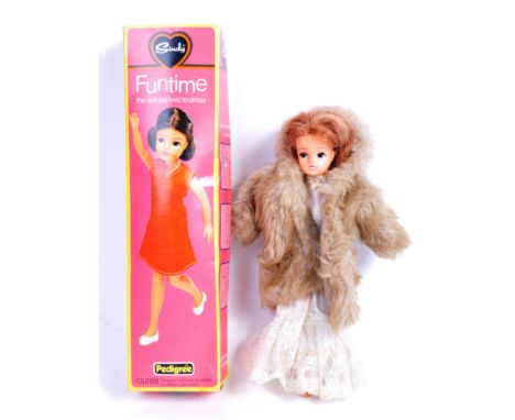 A rare original vintage Pedigree made ' Funtime Sindy ' doll - ' The Doll You Love To Dress '. The doll dressed in a lace wed