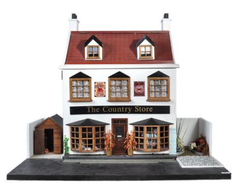 A beautiful original dolls house / doll's house shop ' The Country Store '. The shop based on a 1920's / 1930's traditional B
