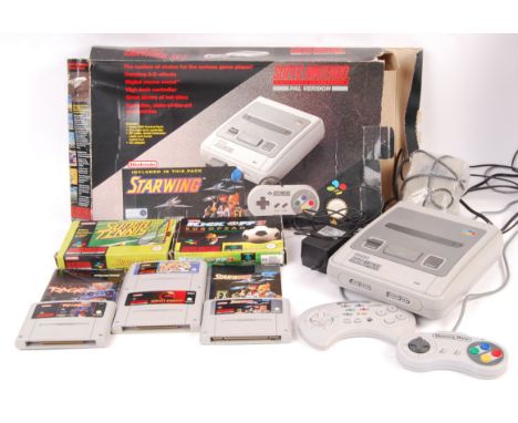 A vintage SNES Super Nintendo Entertainment System video games computer console with official A/C adaptor, unofficial aerial,
