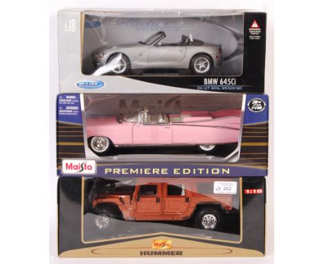 A collection of x3 1/18 scale precision diecast boxed models. Comprising: a Maisto 36643 ' Hummer - 10th Anniversary ', a Wel