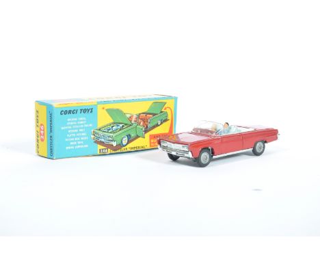 An original vintage Corgi Toys made diecast model 246 Chrysler Imperial. Red body with blue interior and spoked wheels. Compl
