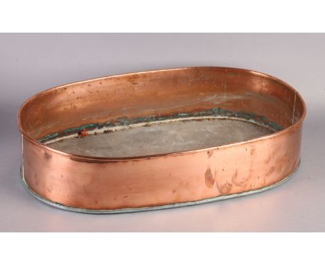 AN EARLY 20TH CENTURY COPPER TROUGH of oval outline, 60.5cm x 38cm x 13cm high 