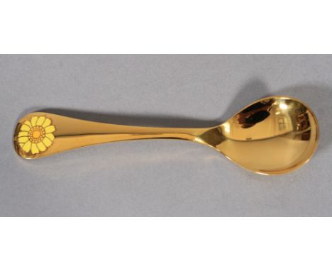 GEORG JENSEN, a .925 silver gilt year spoon for 1973 with corn marigold motif in yellow enamel, 15cm long 