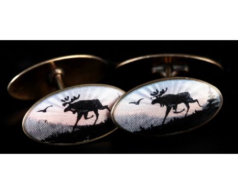 A PAIR OF NORWEGIAN SILVER GILT AND ENAMEL CUFFLINKS BY AKSEL HOLMSEN each oval face with a polychrome guilloche scene of a E