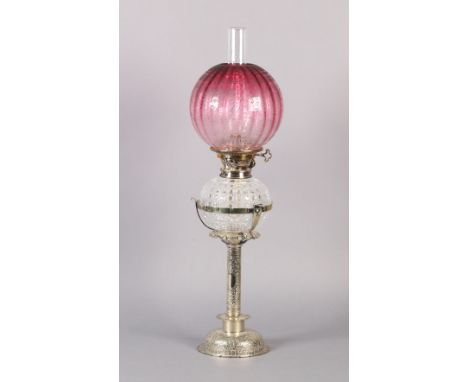 AN EDWARD VII SILVER PLATED OIL LAMP with hob nail cut reservoir and cranberry glass shade, the column and domed base embosse