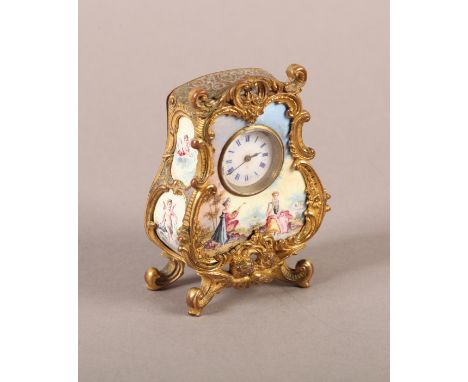 A LATE 19TH CENTURY VIENNESE ORMOLU AND ENAMEL CLOCK, in ornate rococo case centred at the base with a pair of kissing winged